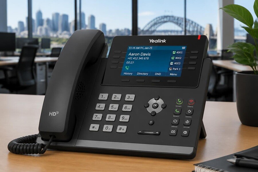 Yealink T-series IP desk phone on a modern Sydney office desk